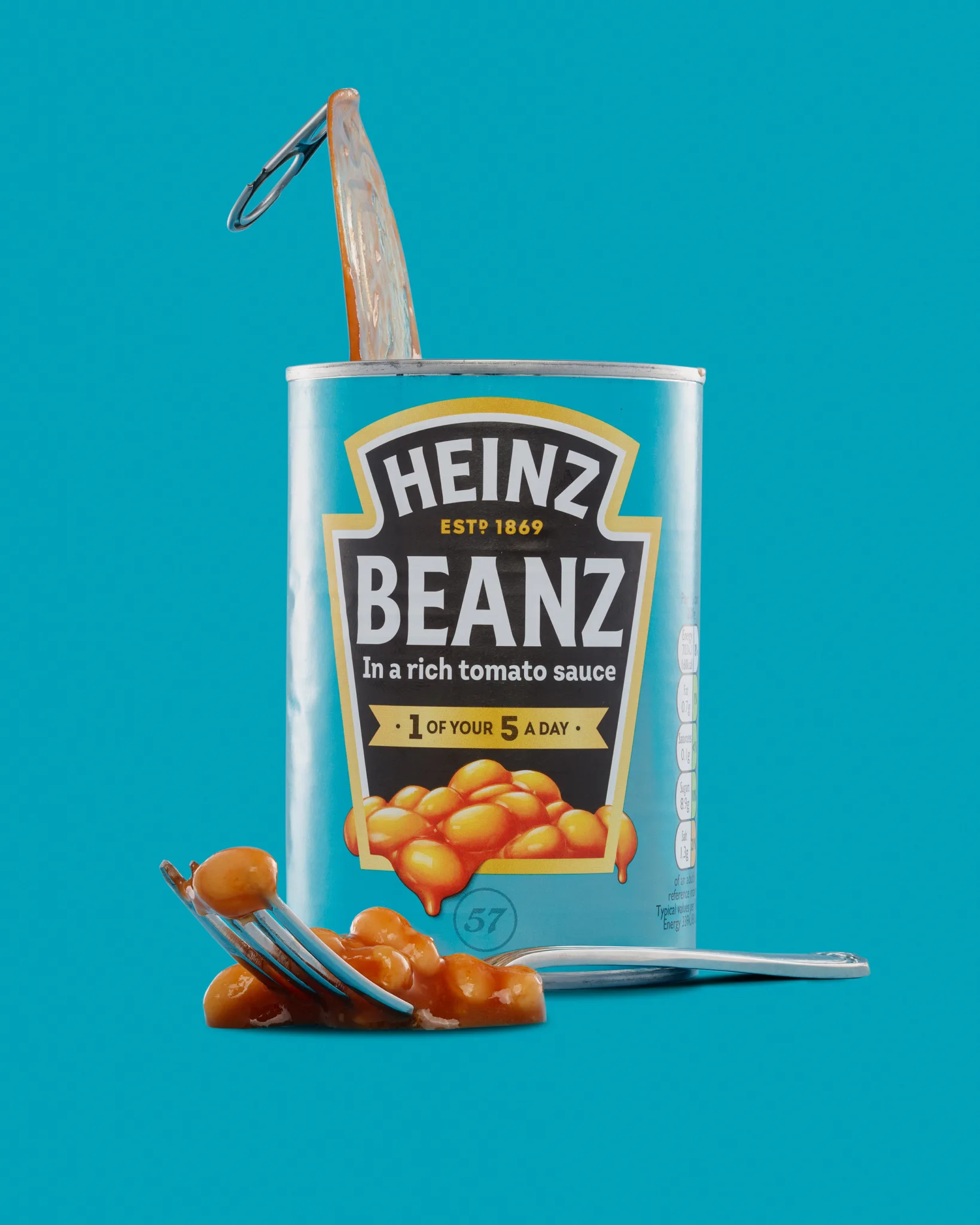 Open can of Heinz Beanz with spilled beans