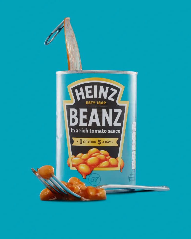 Open can of Heinz Beanz with spilled beans