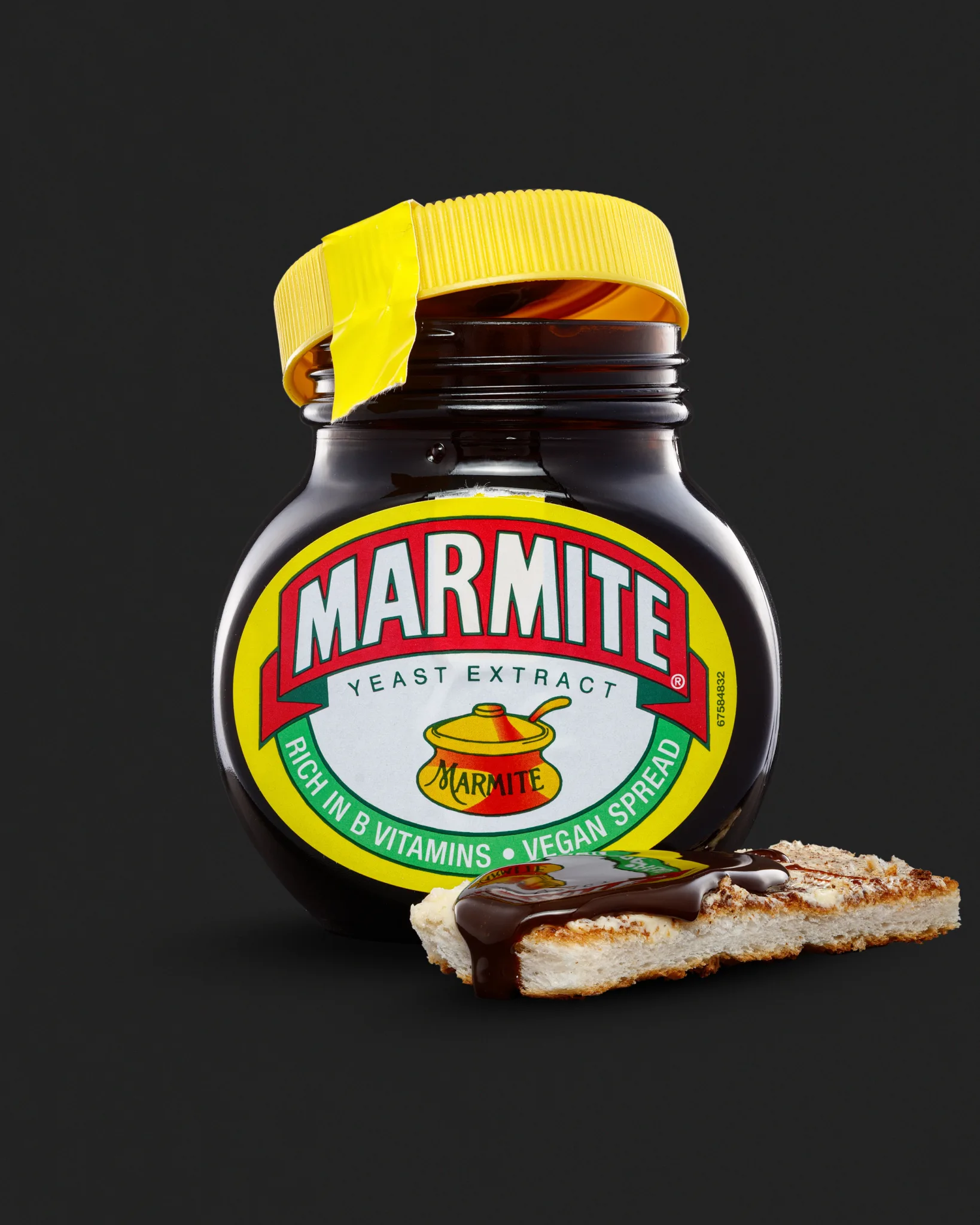 Marmite jar with spread on toast slice