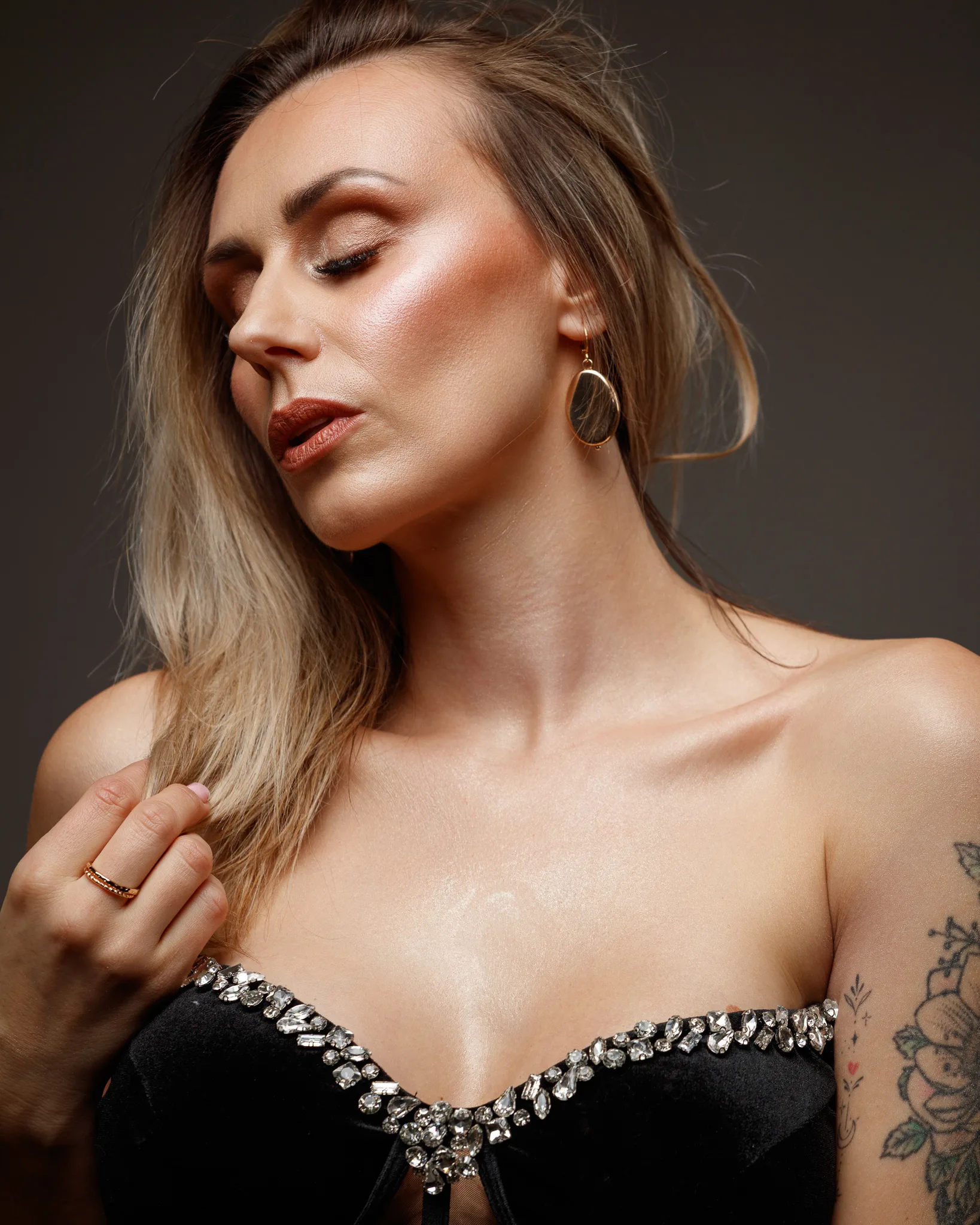 Woman in elegant black dress, side profile