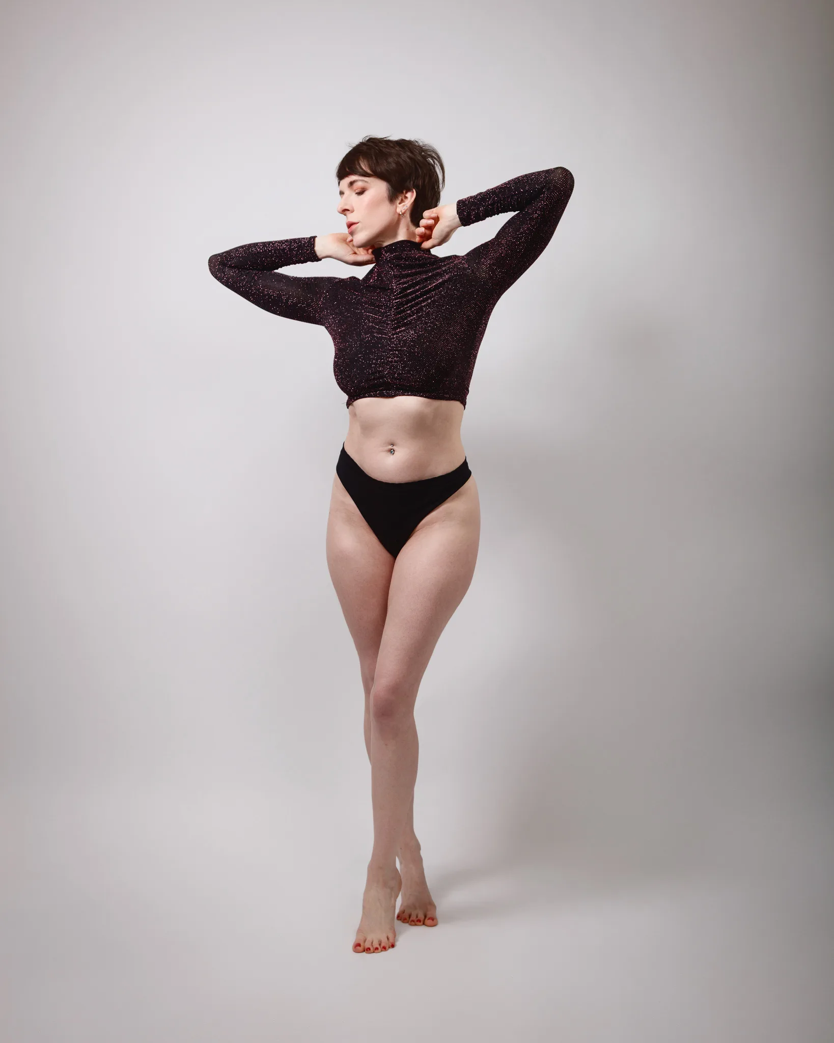 Person posing in stylish black dancewear