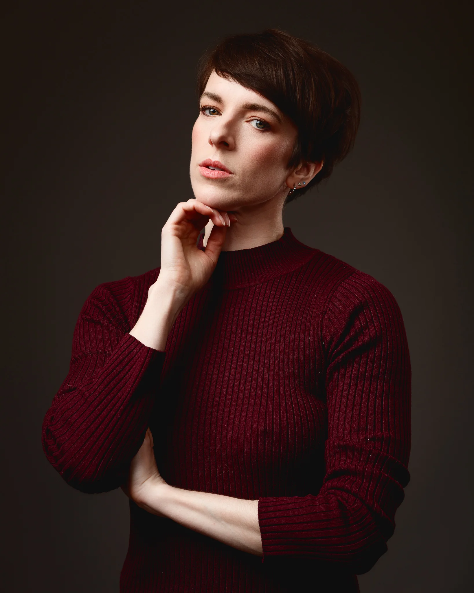 Person posing in a burgundy jumper