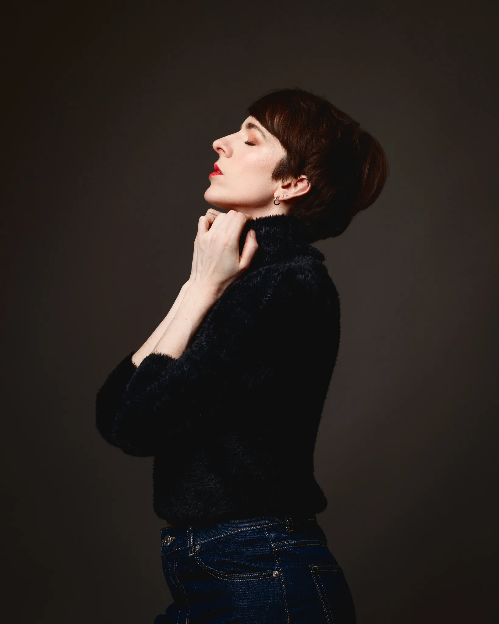 Profile photo of person in black jumper.