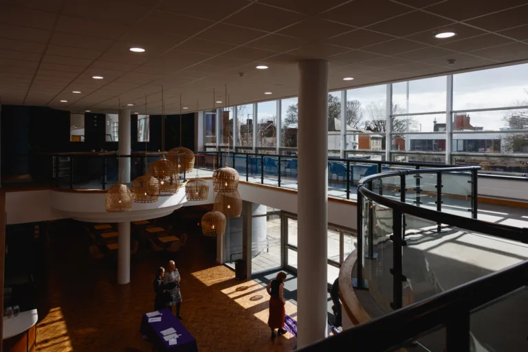 Modern atrium with large windows and seating