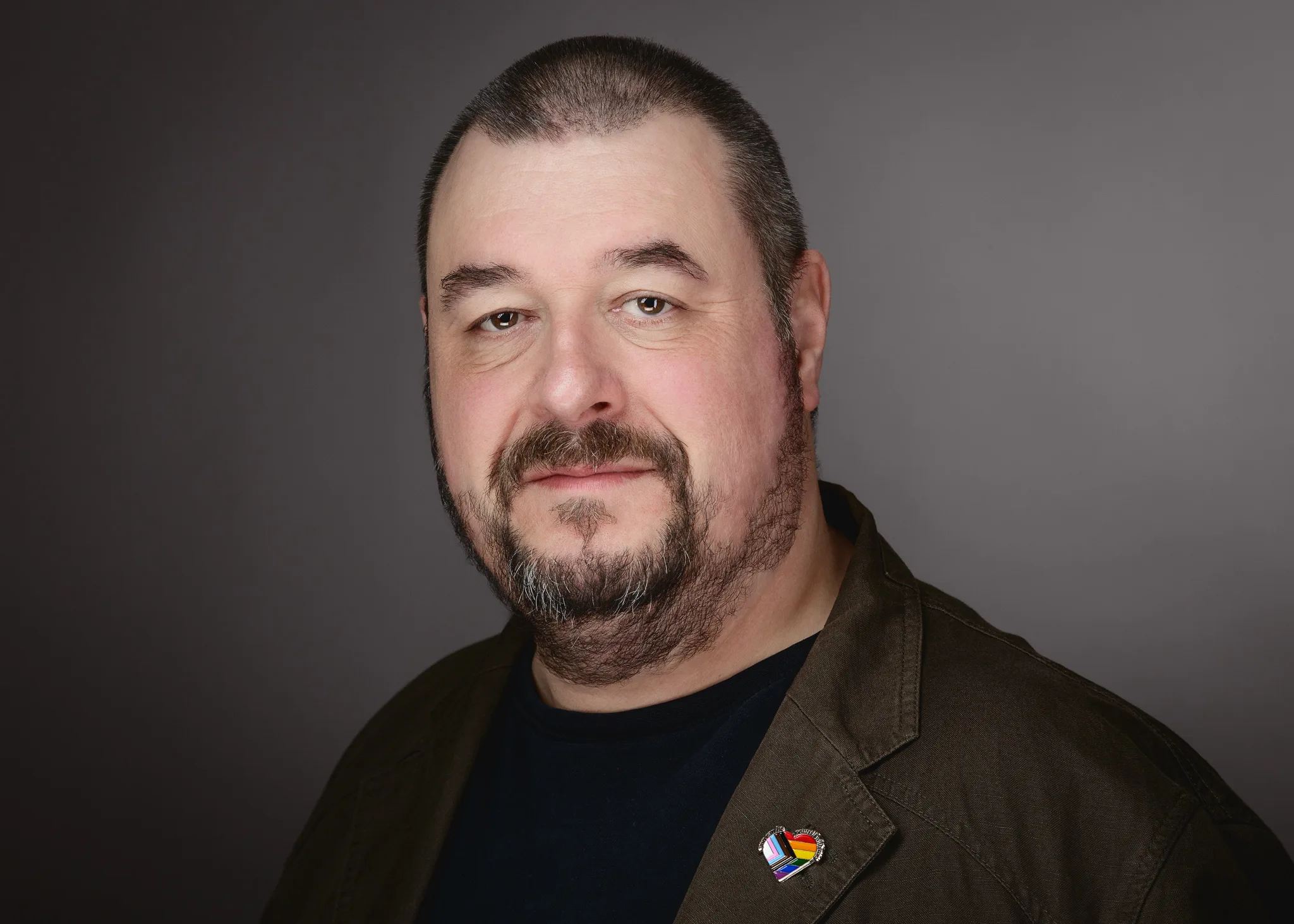 Bob Foyers, commercial portrait photographer based in Rendlesham, Suffolk, wearing an allyship badge