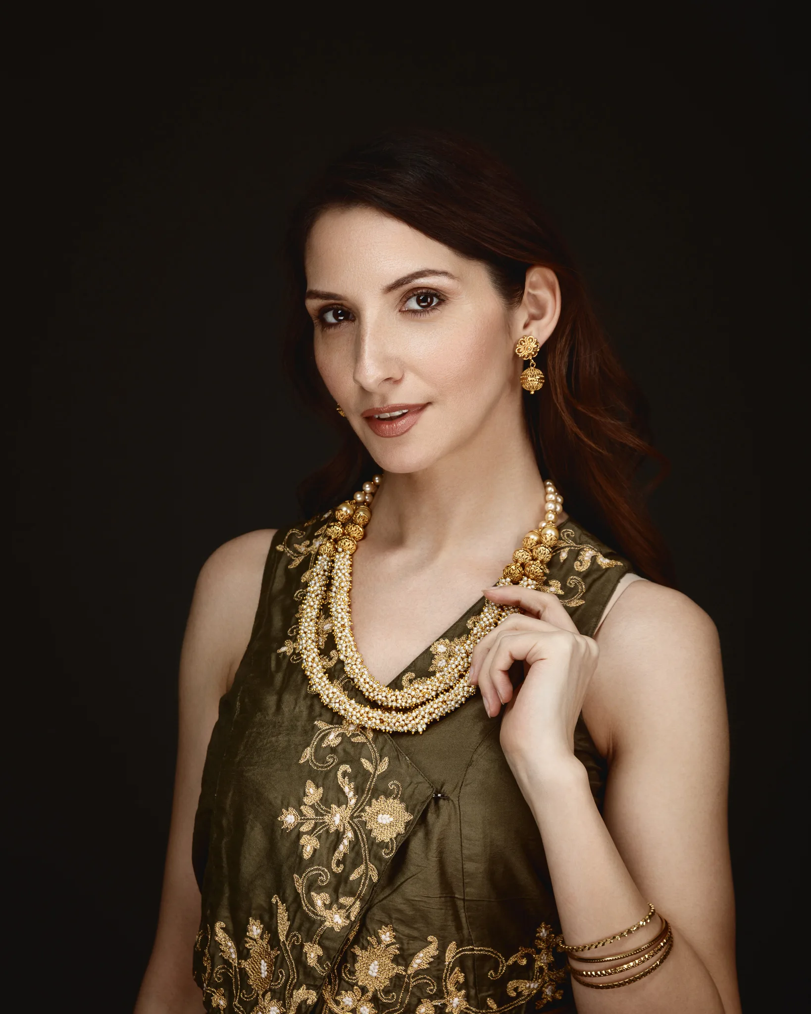 Woman wearing traditional jewelry and attire