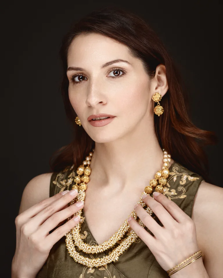 Woman wearing elegant jewellery and green dress