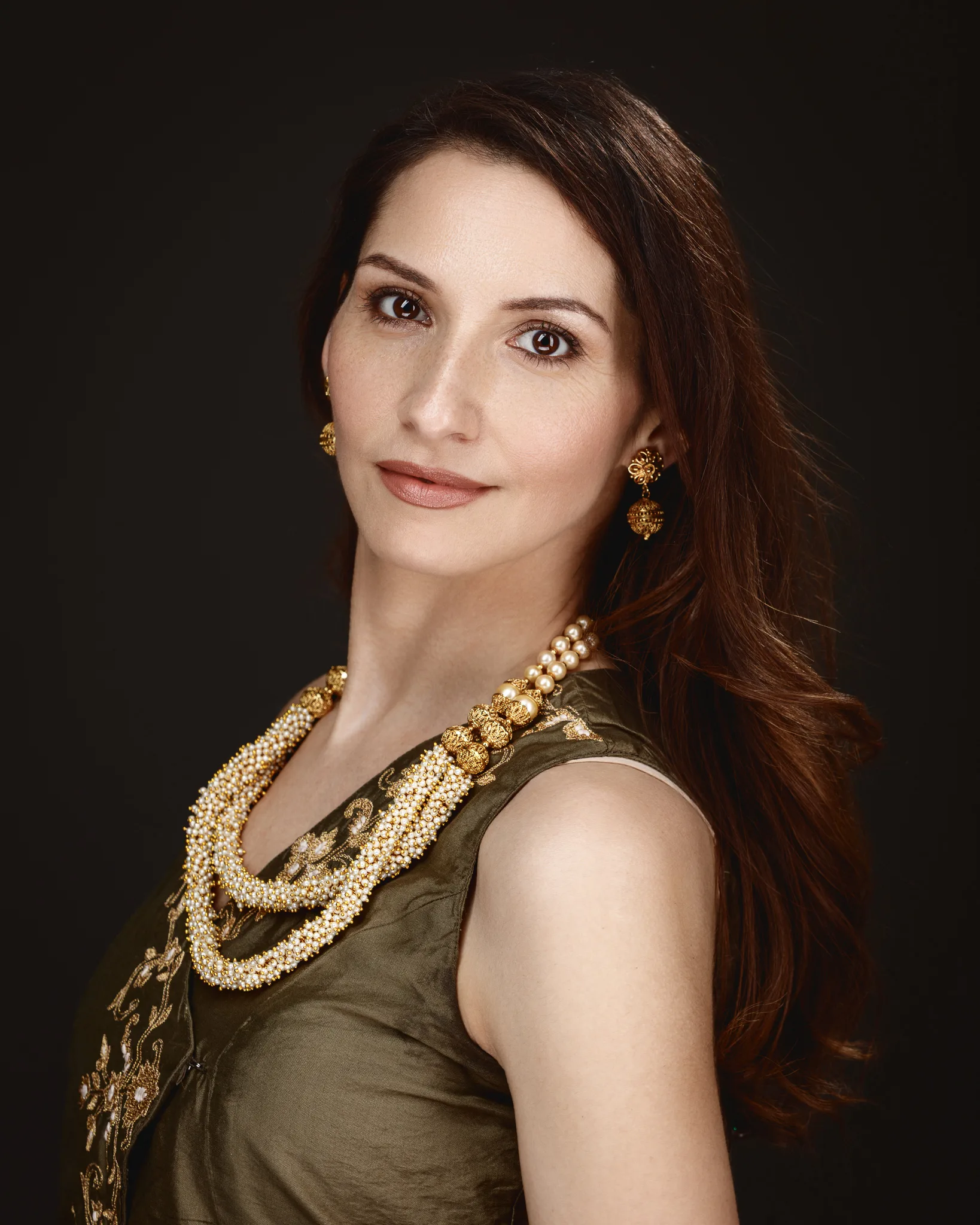 Elegant woman with long necklace