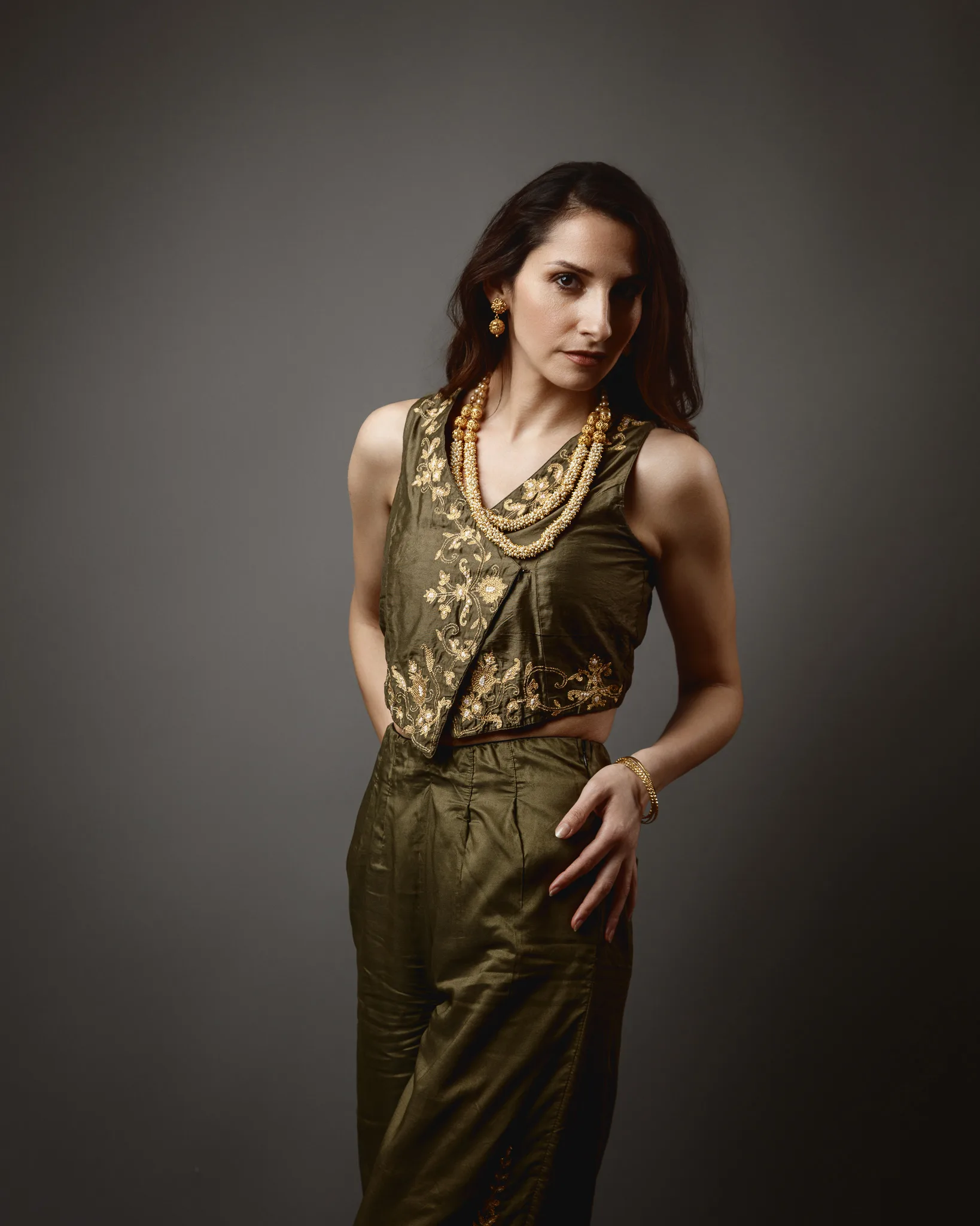Woman in stylish embroidered outfit