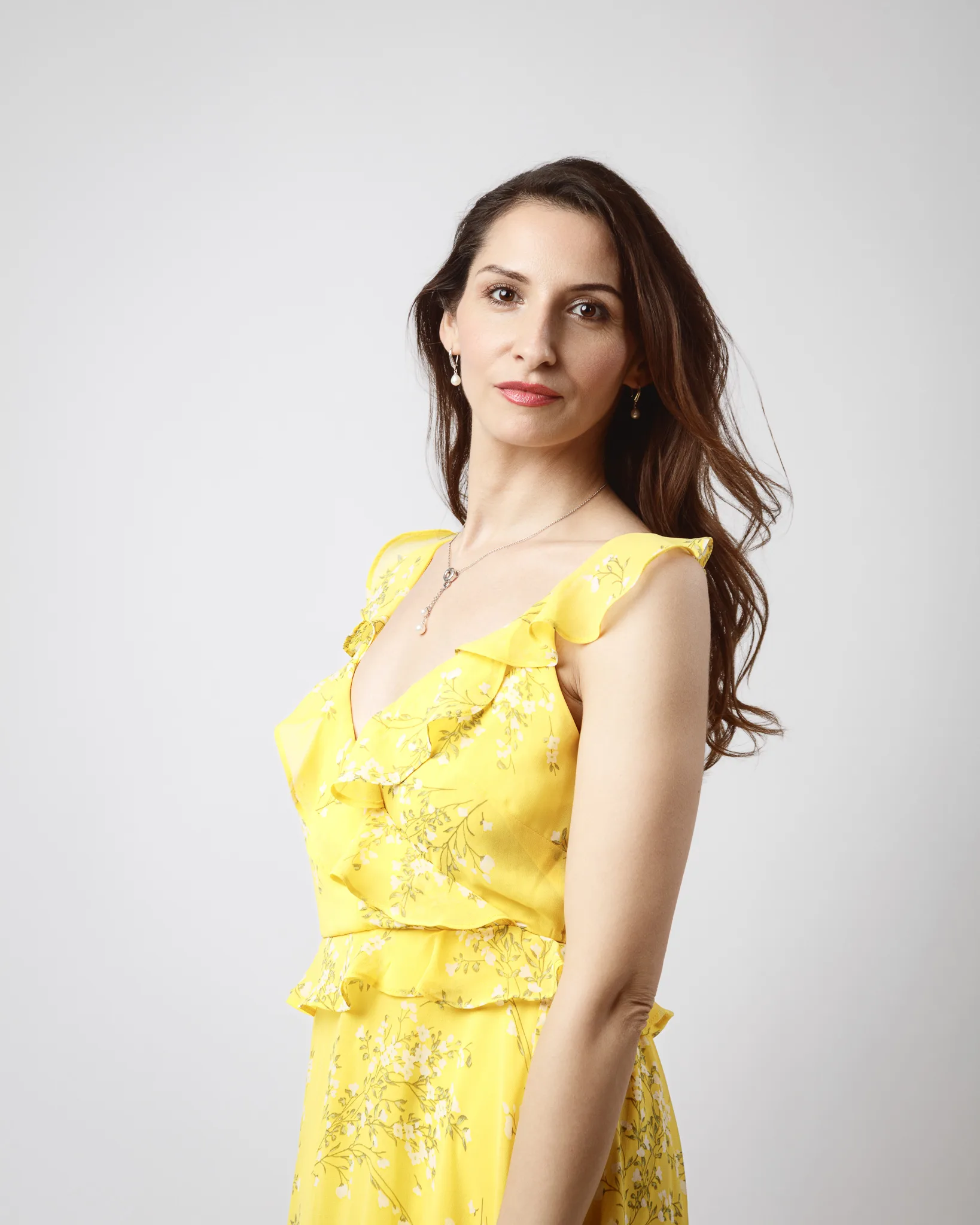 Woman in yellow floral dress