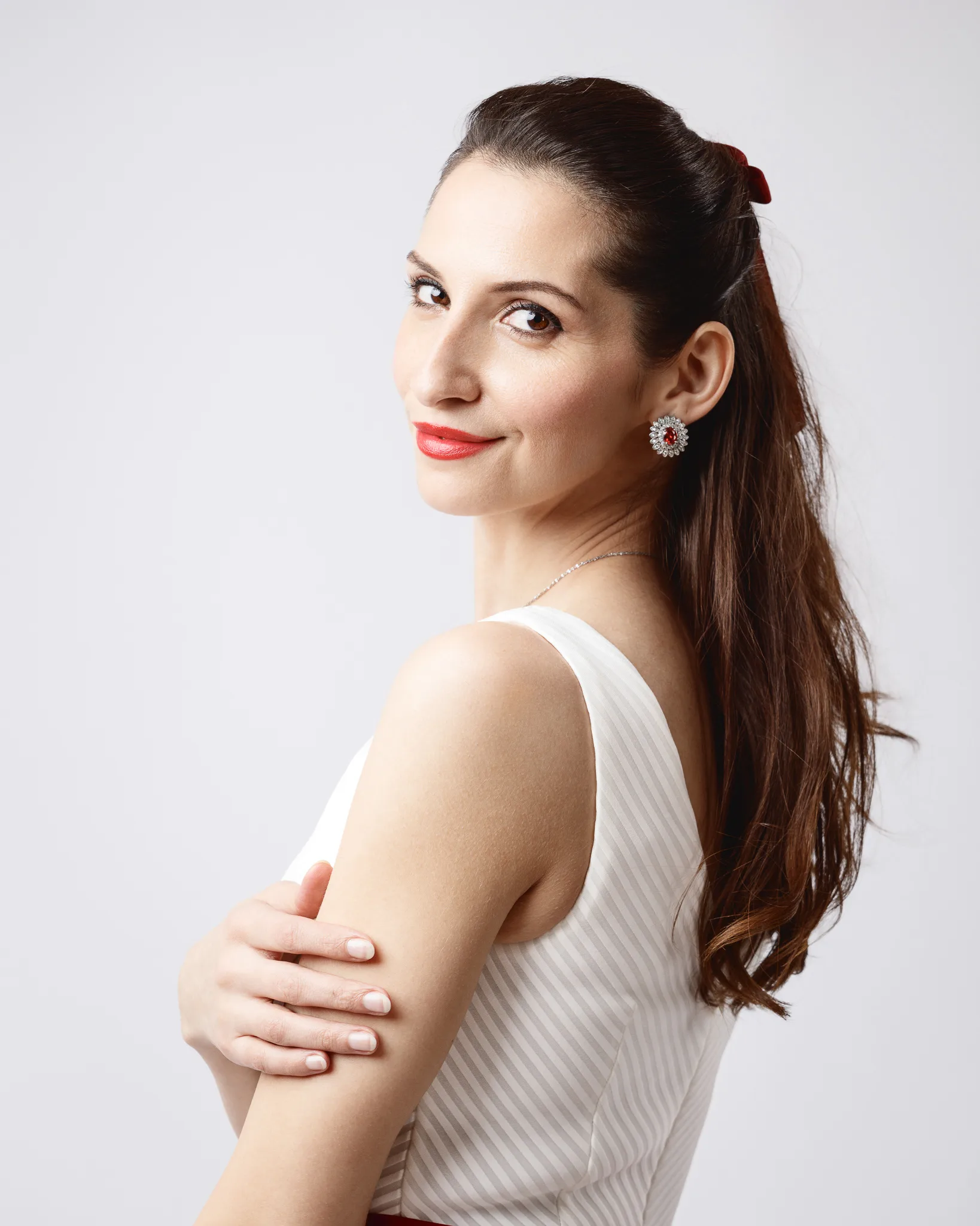 Woman in white dress with red lipstick