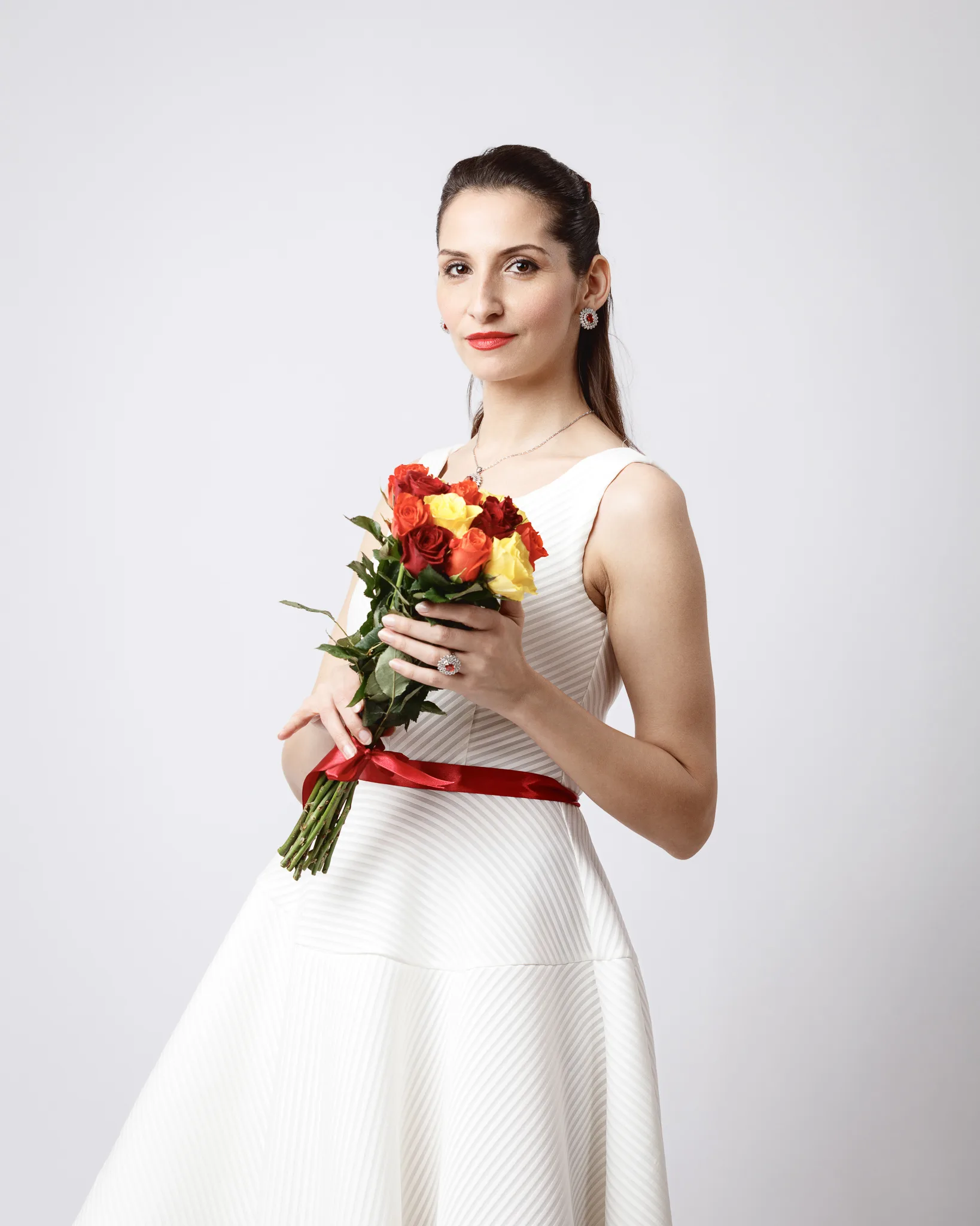 Woman holding a bouquet of roses.
