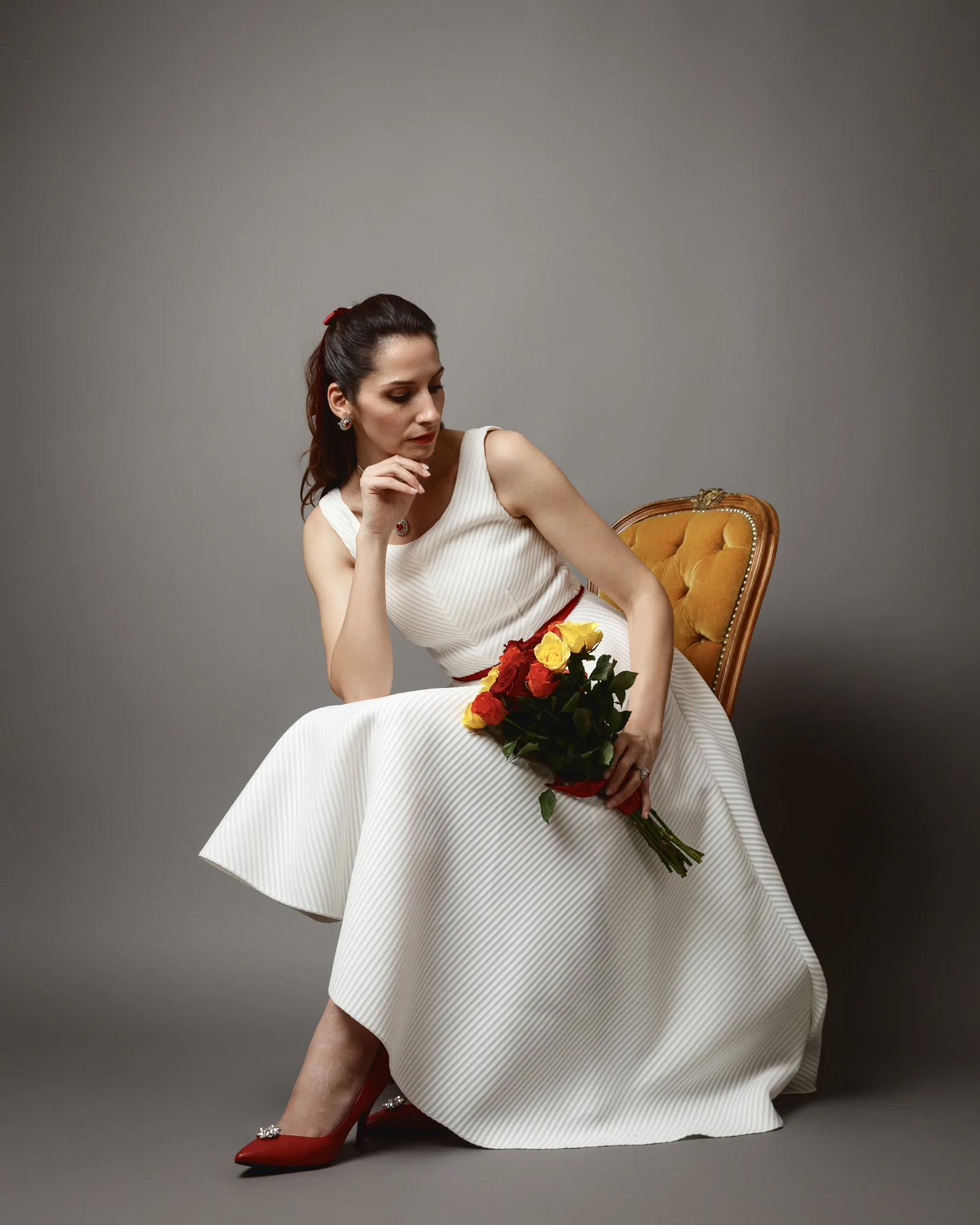 Woman in white dress with flower bouquet