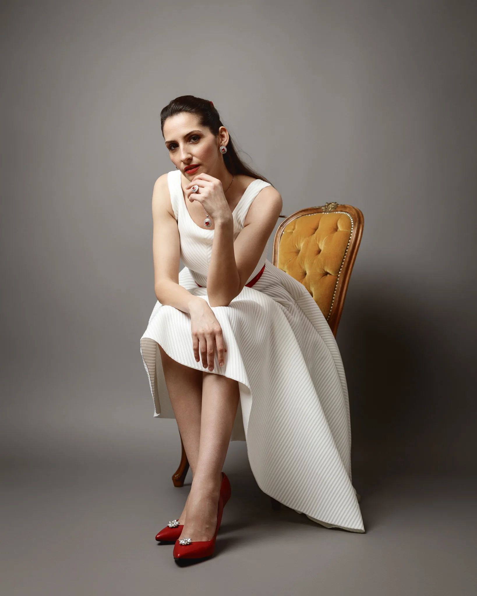 Woman in white dress on a chair
