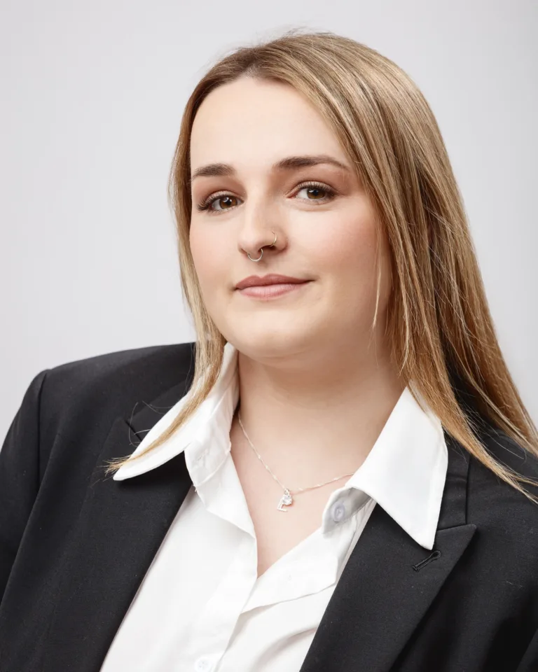 Woman in formal attire with nose ring.