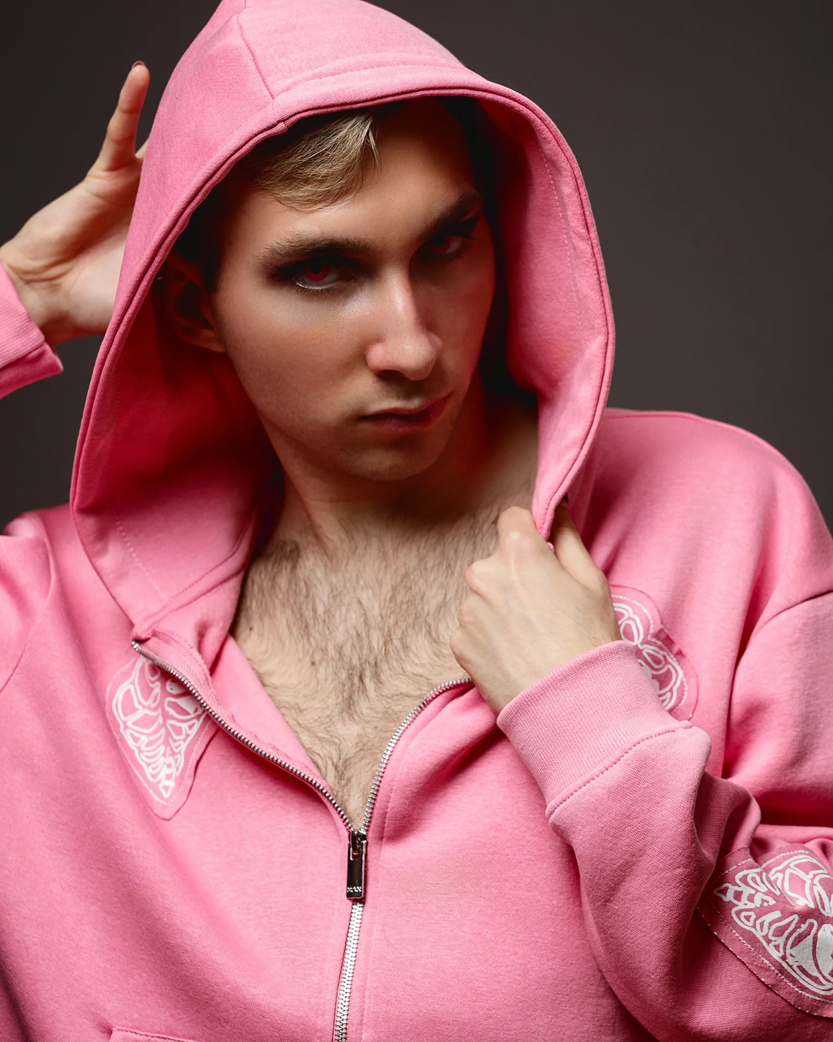 Person in pink hoodie posing