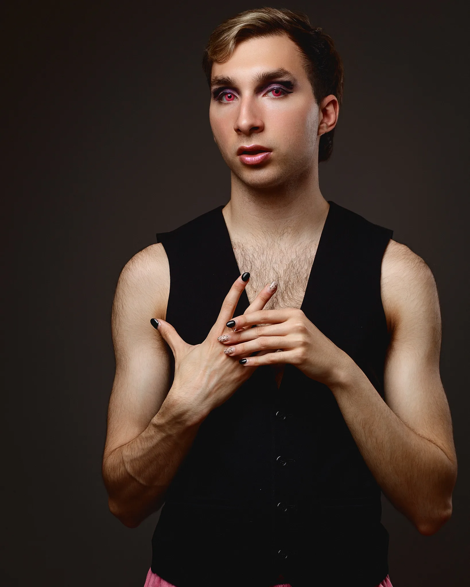 Man posing with dramatic makeup