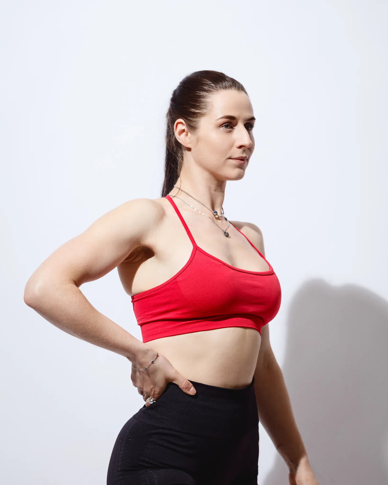 Woman in red sports bra and leggings