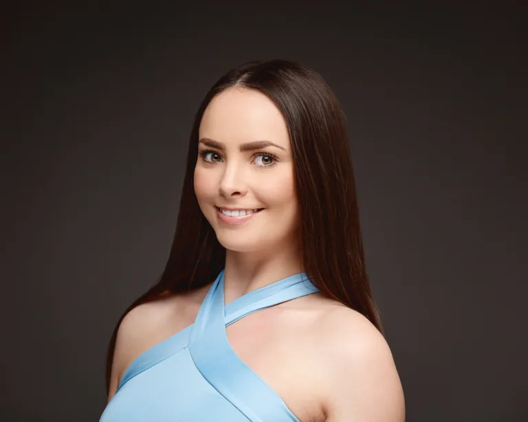 Smiling woman in blue halter top portrait