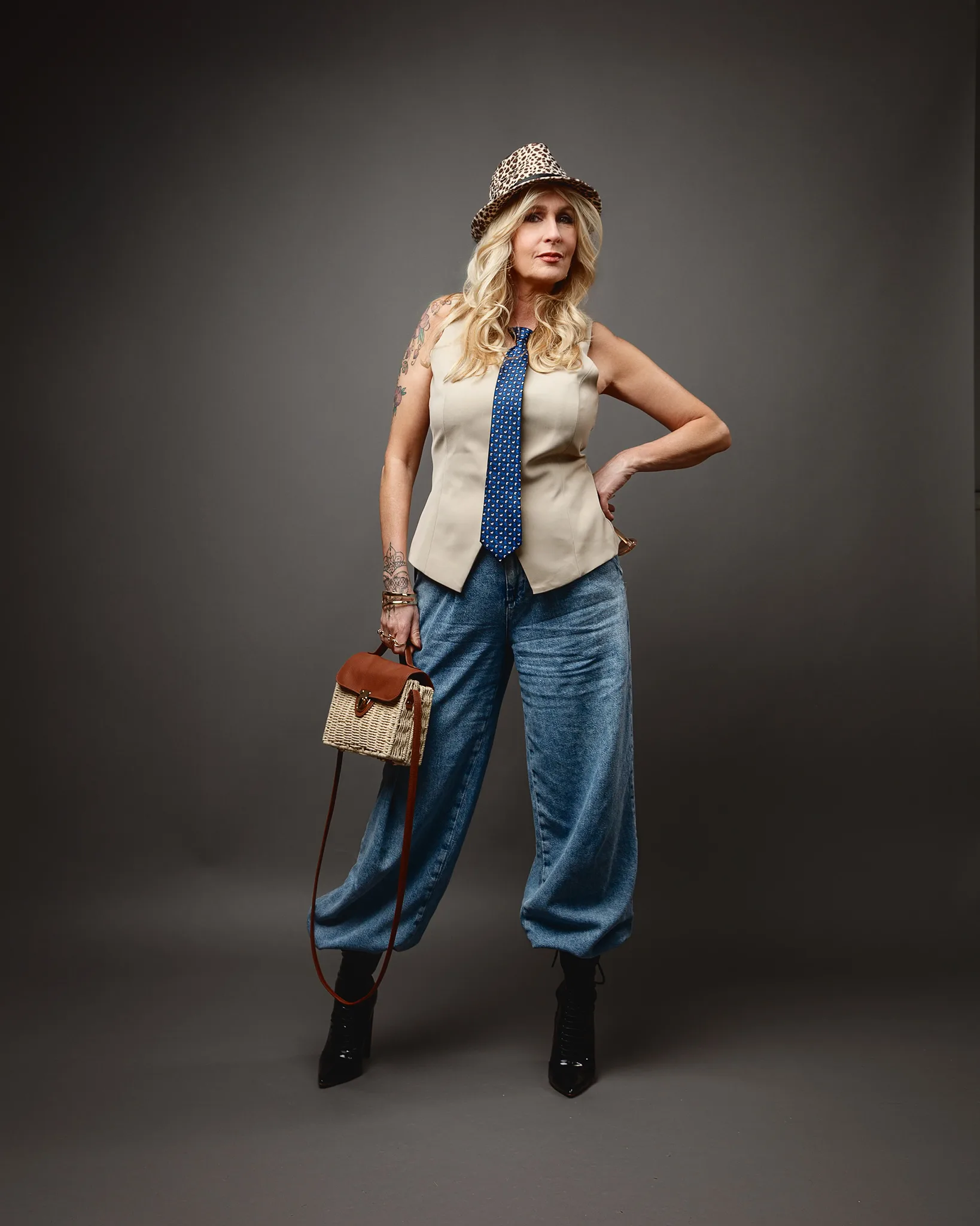 Stylish woman in hat and wide-leg jeans