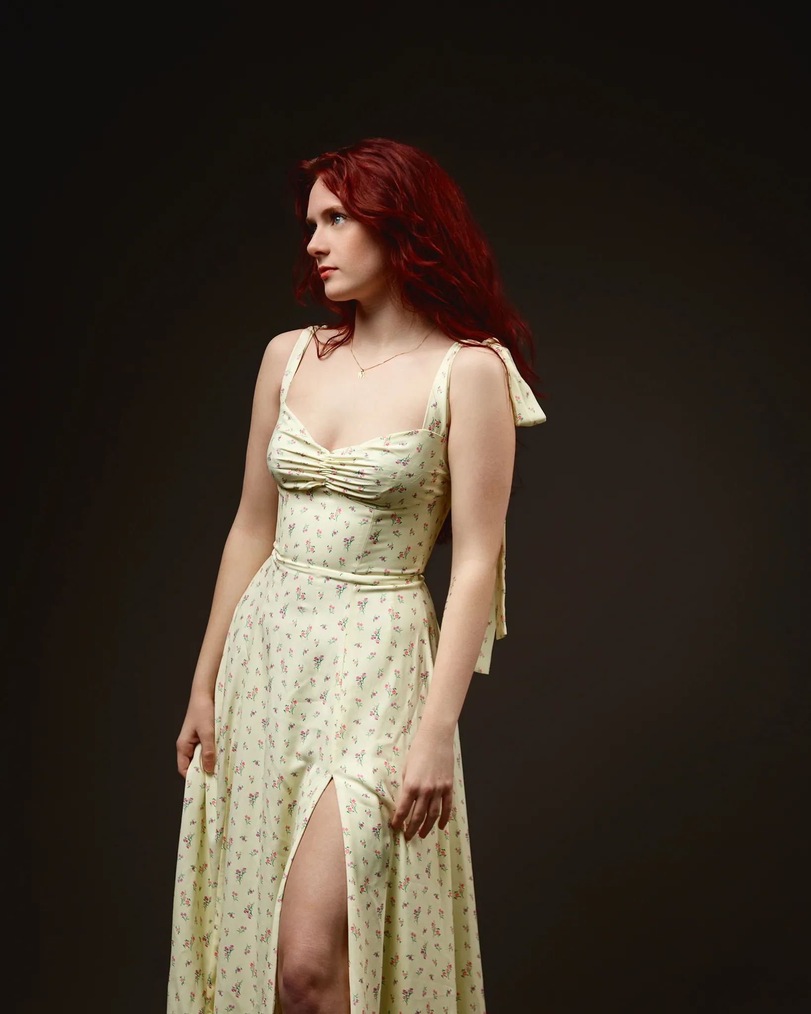 Red-haired woman in yellow floral dress