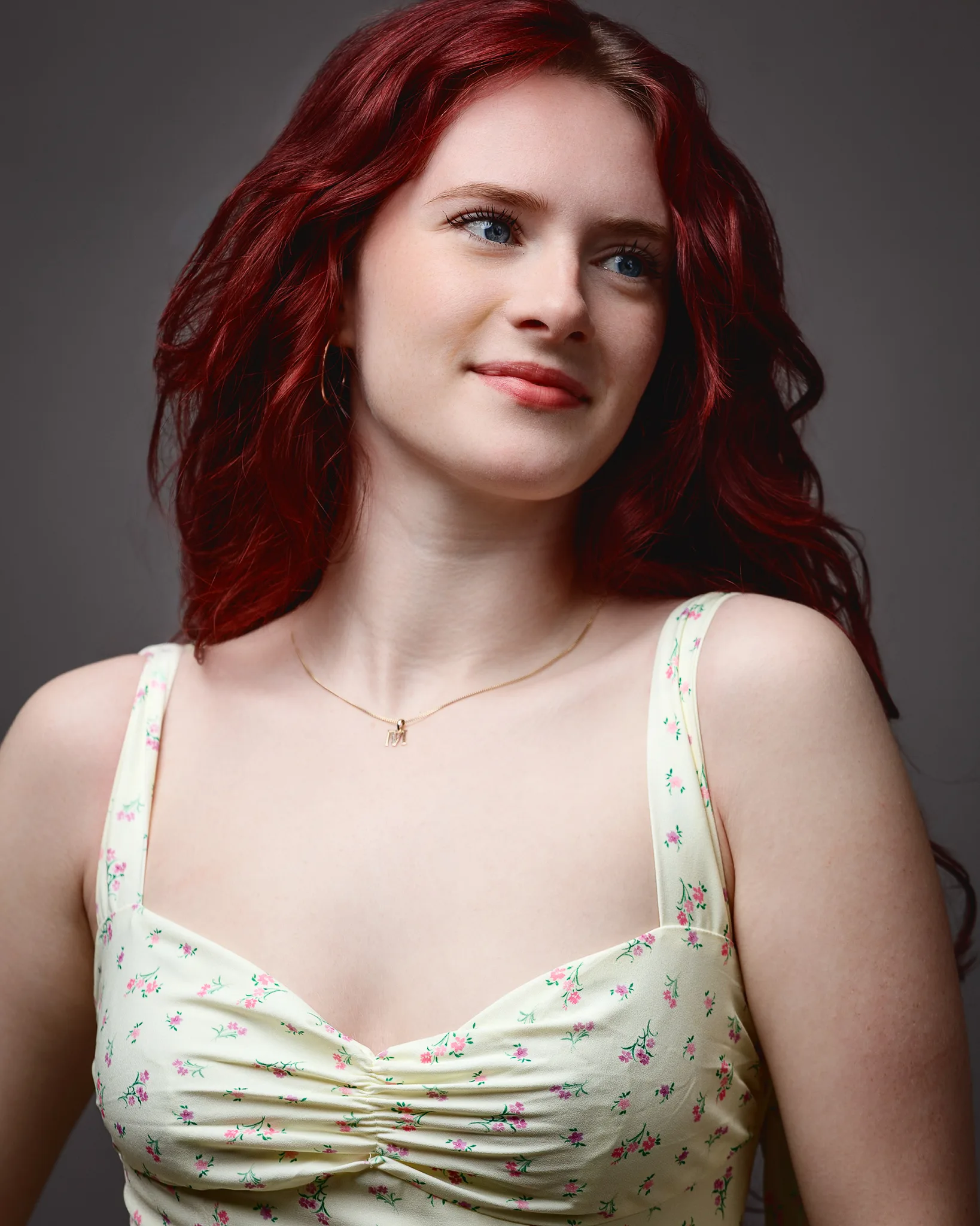 Red-haired woman in floral dress portrait