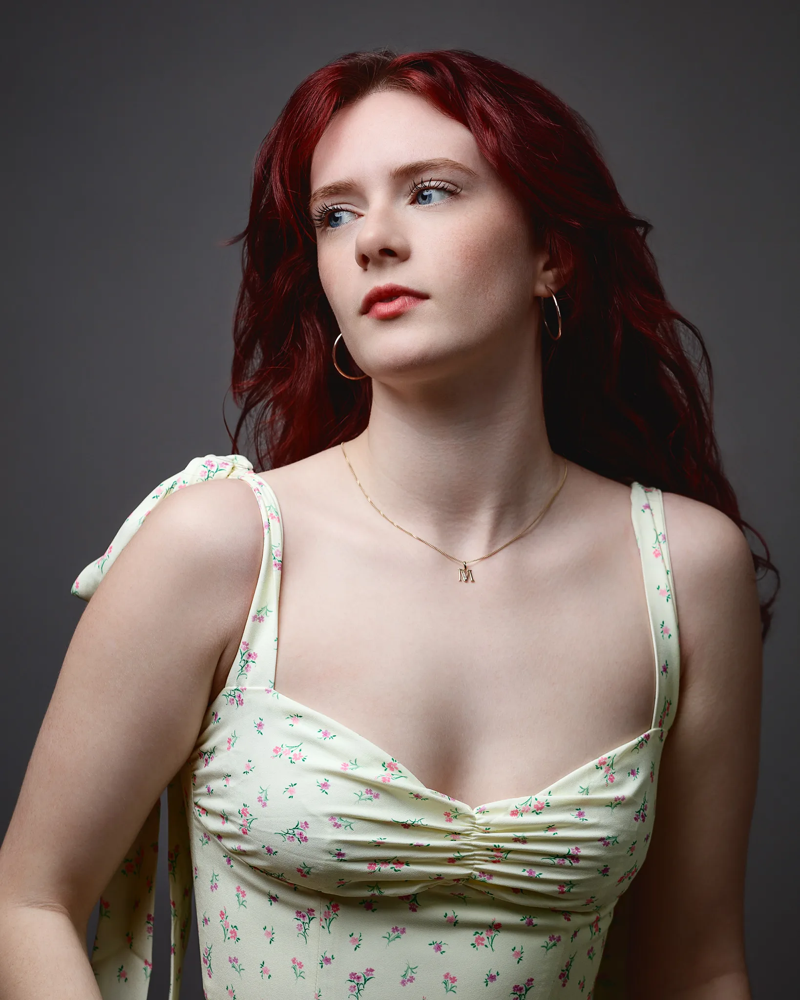Red-haired woman in floral dress portrait
