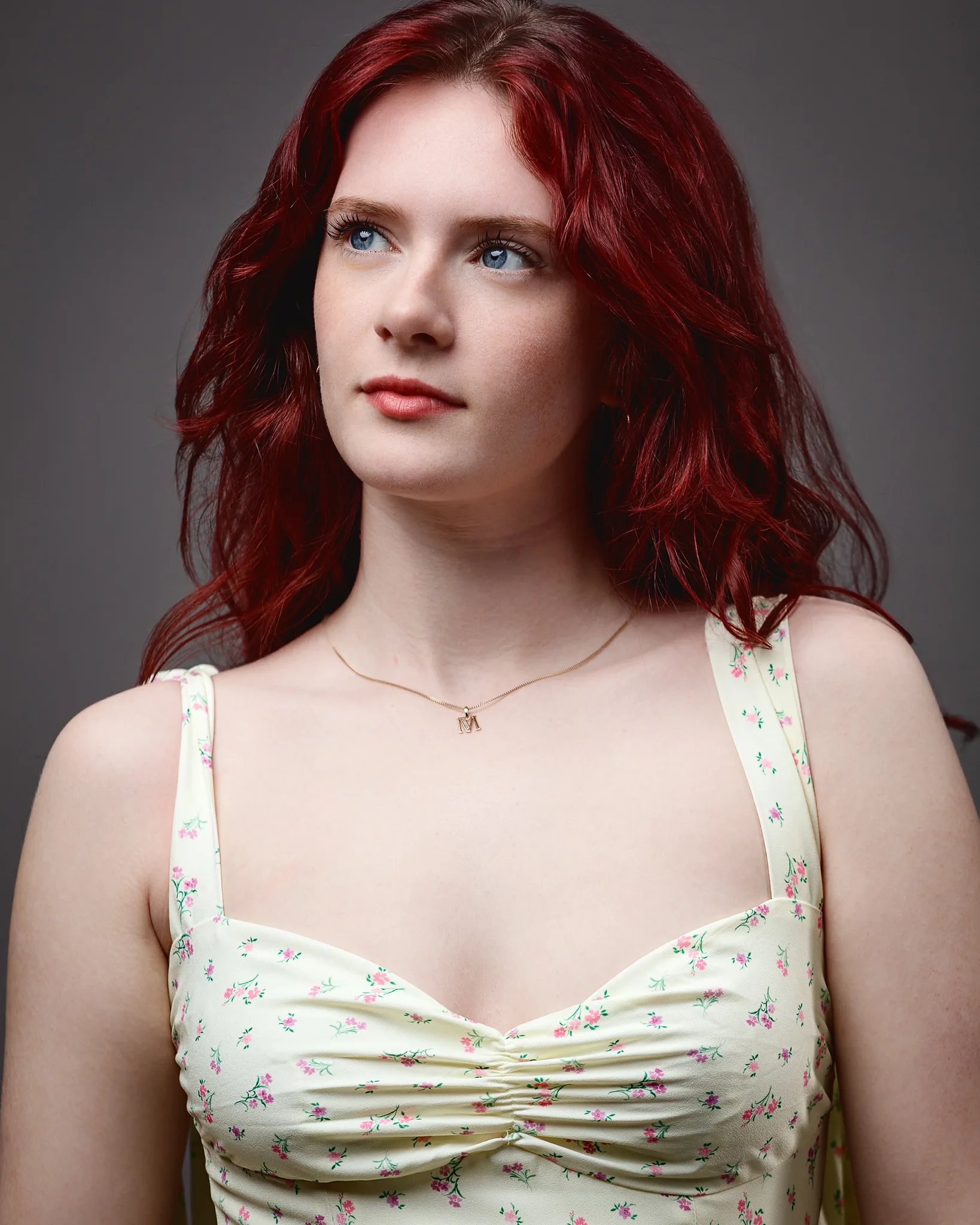 Red-haired woman in floral dress portrait