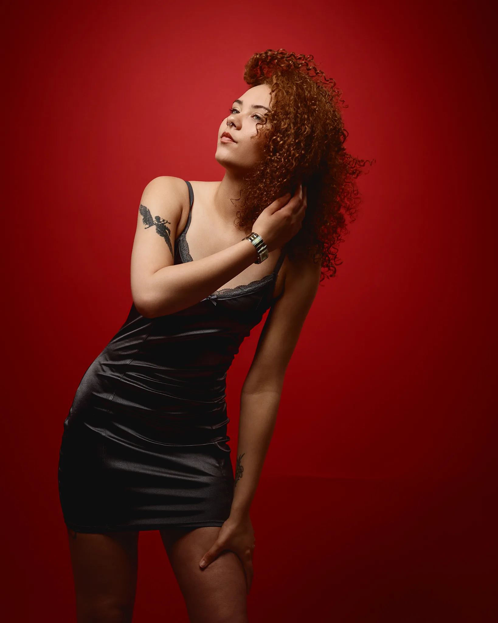 Woman with curly hair in black dress
