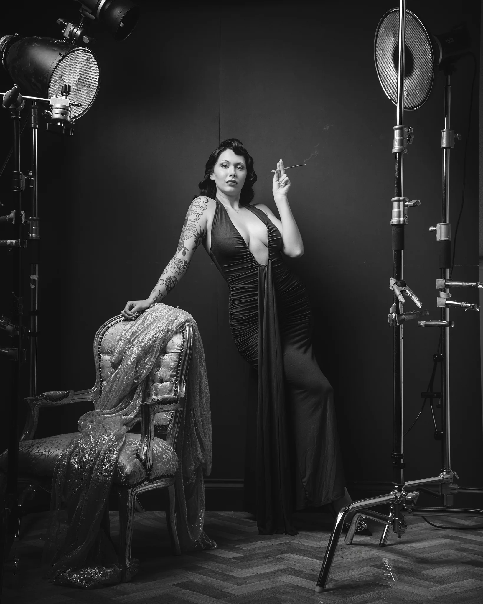 Woman in film studio with professional lighting equipment