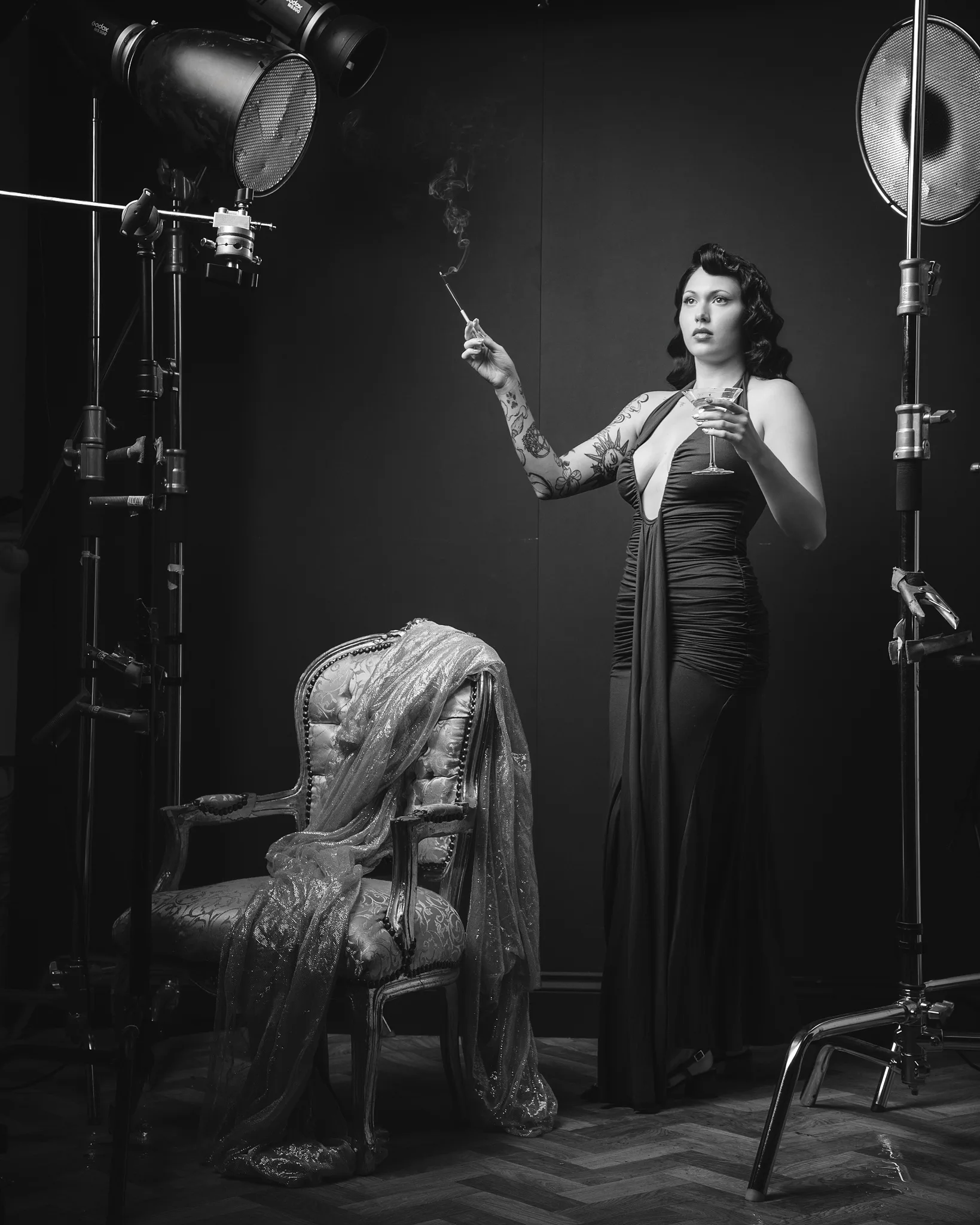 Woman on film set with professional studio lighting equipment