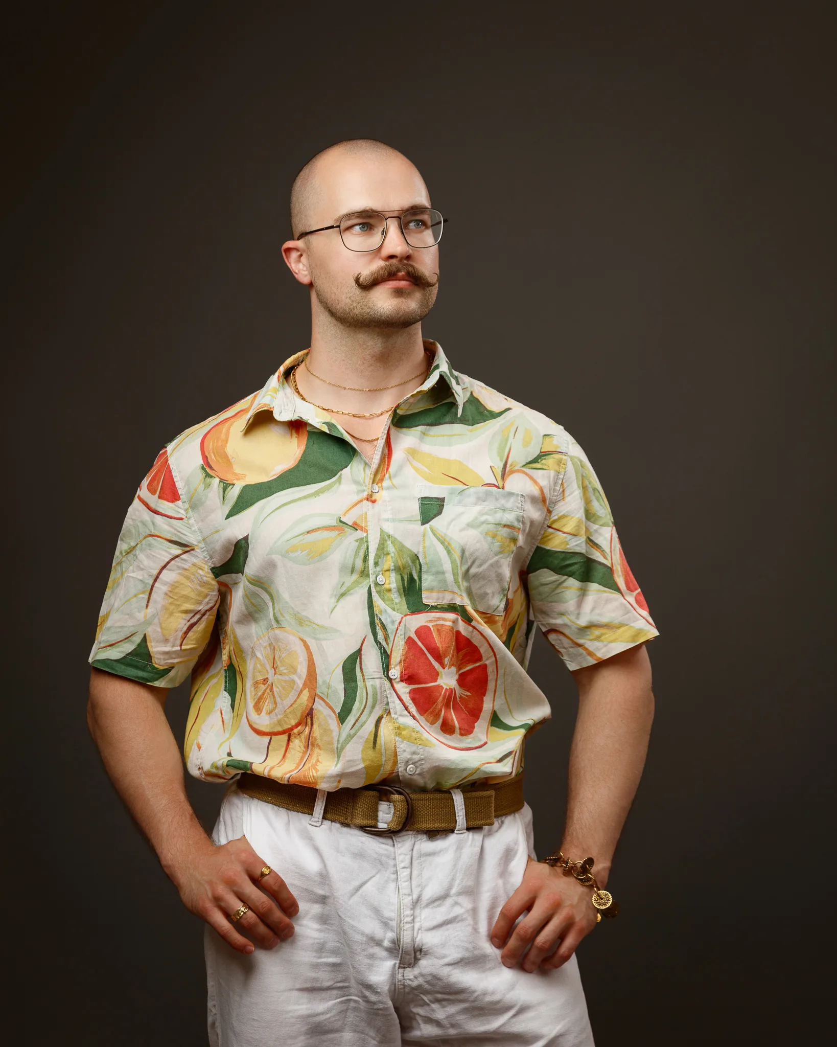 Man wearing colourful citrus fruit patterned shirt and glasses