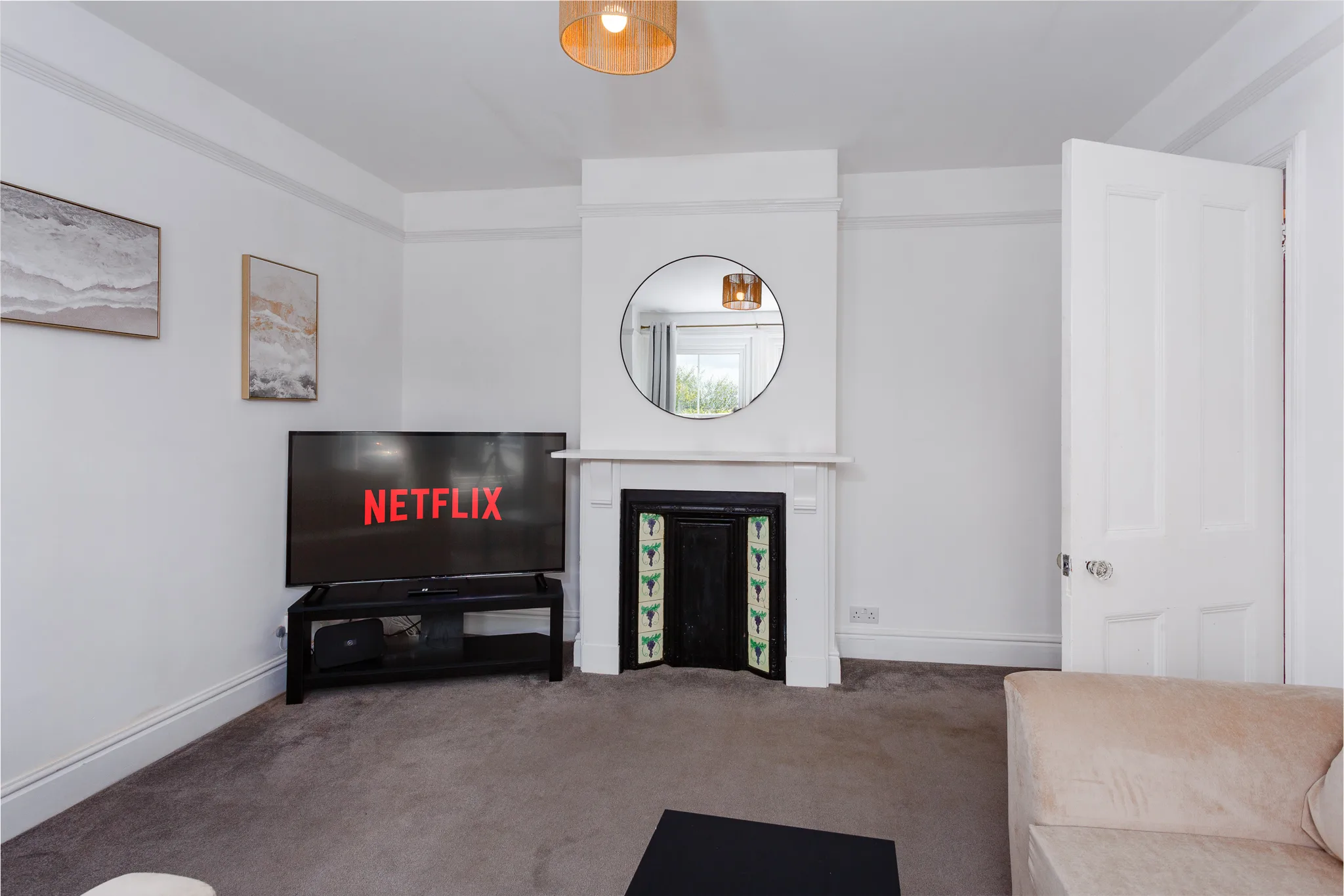 Modern living room with Netflix on TV and fireplace