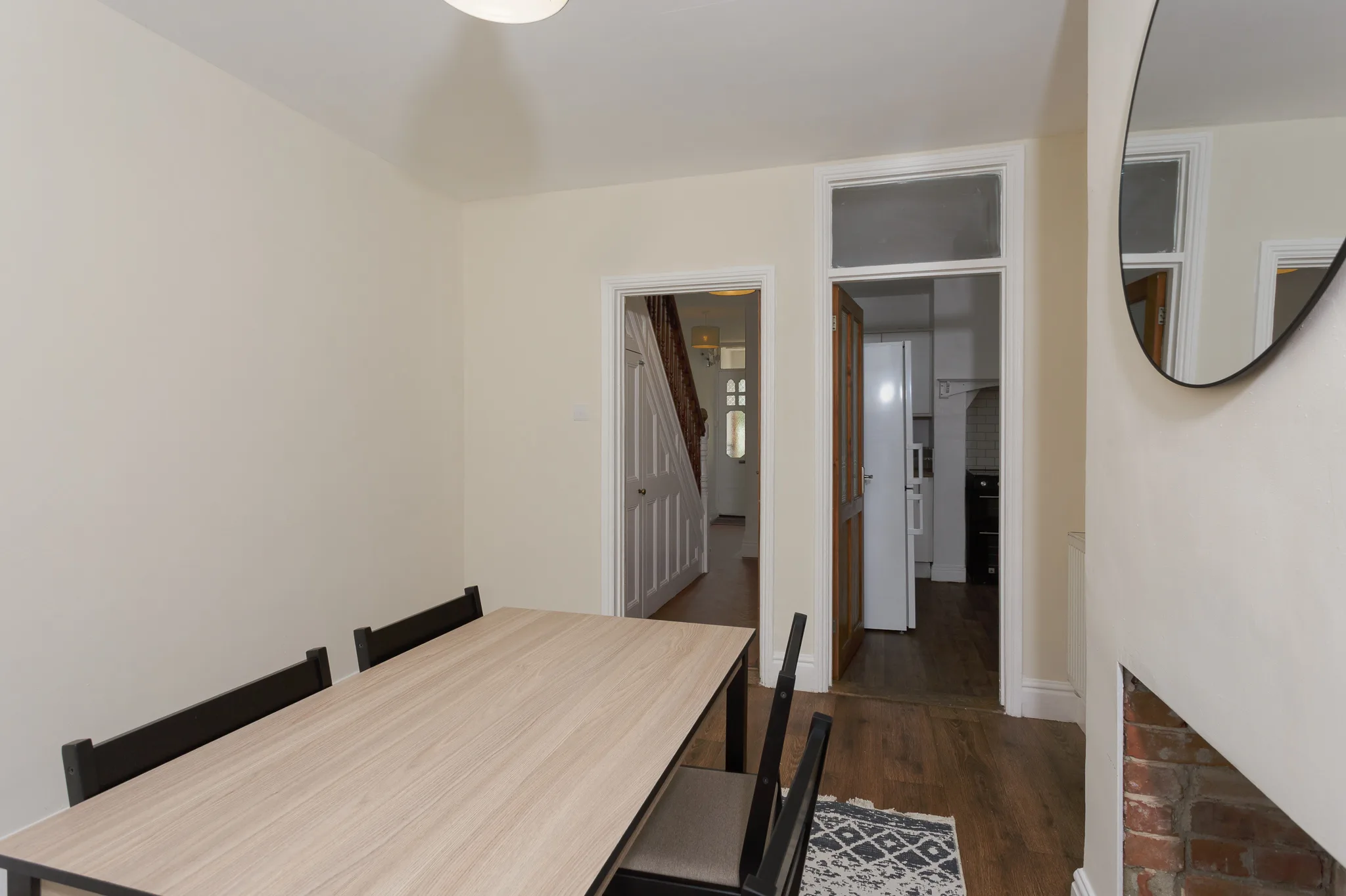 Modern dining room with wooden table and black chairs