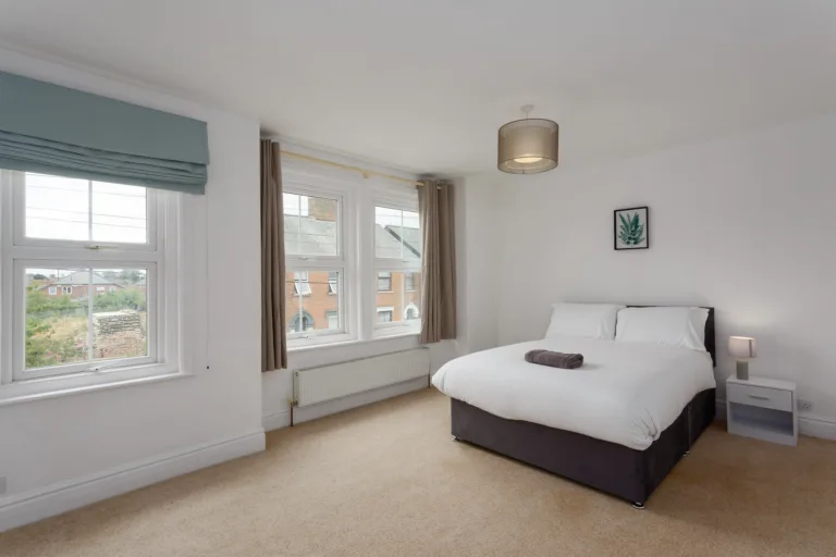 Double bedroom in a Leiston holiday let with daylight held in the windows